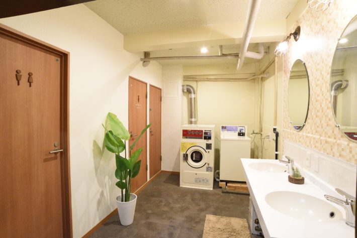 Laundry area and bathroom in another floor