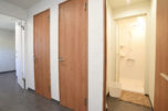 Three shower stalls for both men and women.