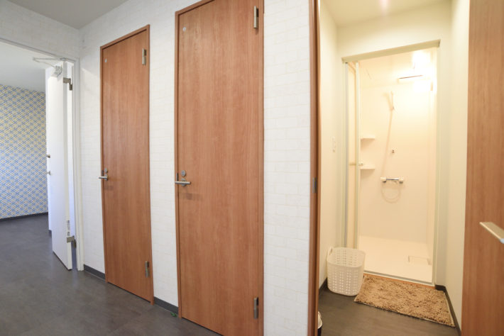 Three shower stalls for both men and women.