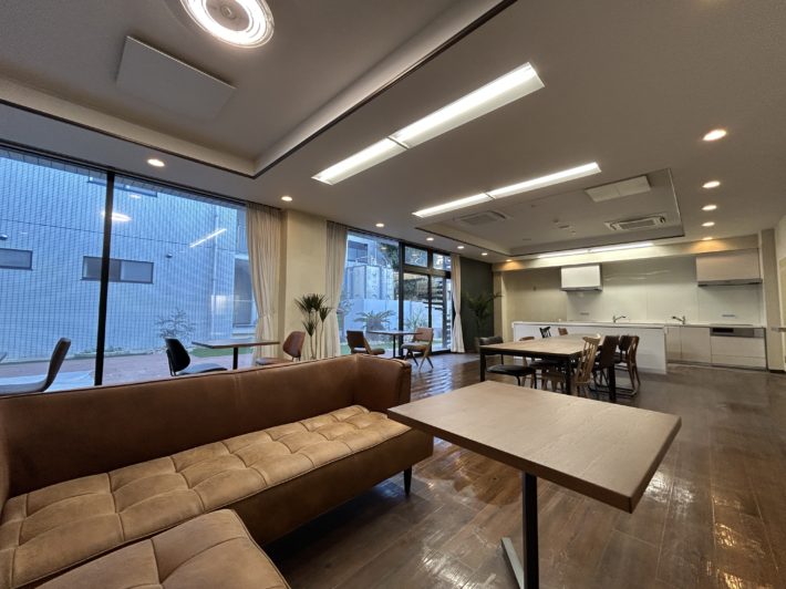 A dining space with a TV and sofa.